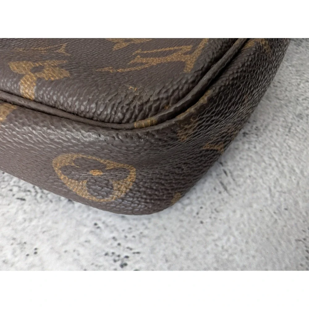 Pochette Accessories with COA crossbody strap and dust bag.